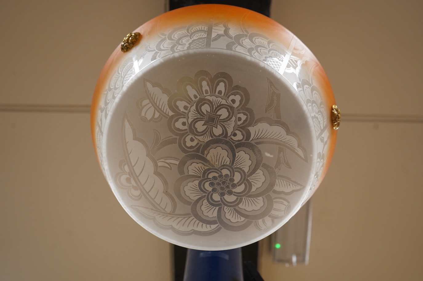 A French frosted glass acid etched with orange colour edge plaffonier ceiling light with original antique brass chain and ceiling rose, circa 1920’s-1930’s, wired, overall 47cm high, top of shade 35.5cm diameter, 13cm de